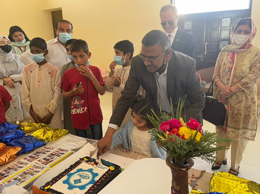 Figure 2: Cake cutting by Guest of Honor Prof. Dr. Bhawani Shankar Chowdhry with one of the girls of SOS Village.